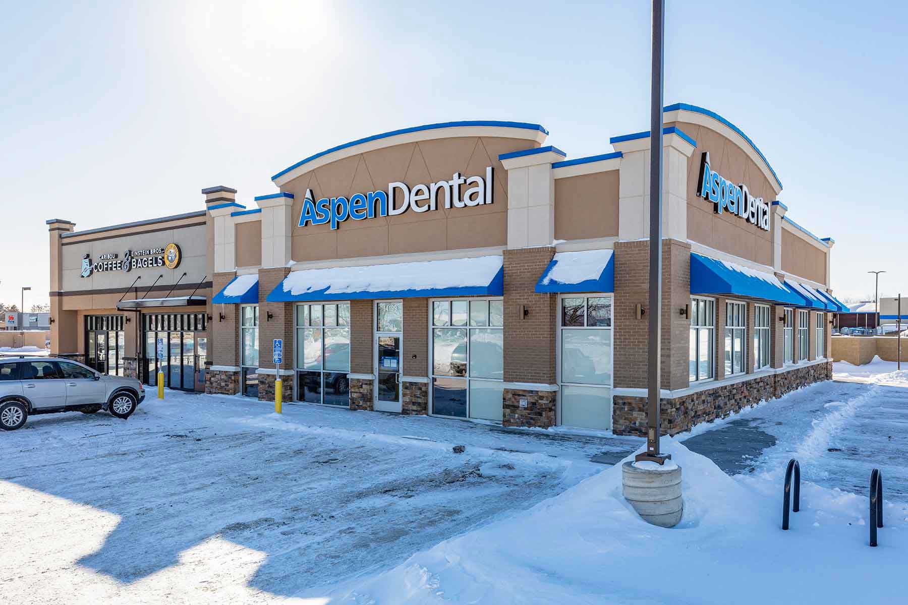 Aspen Dental and Caribou Coffee with Einstein Bagels Building